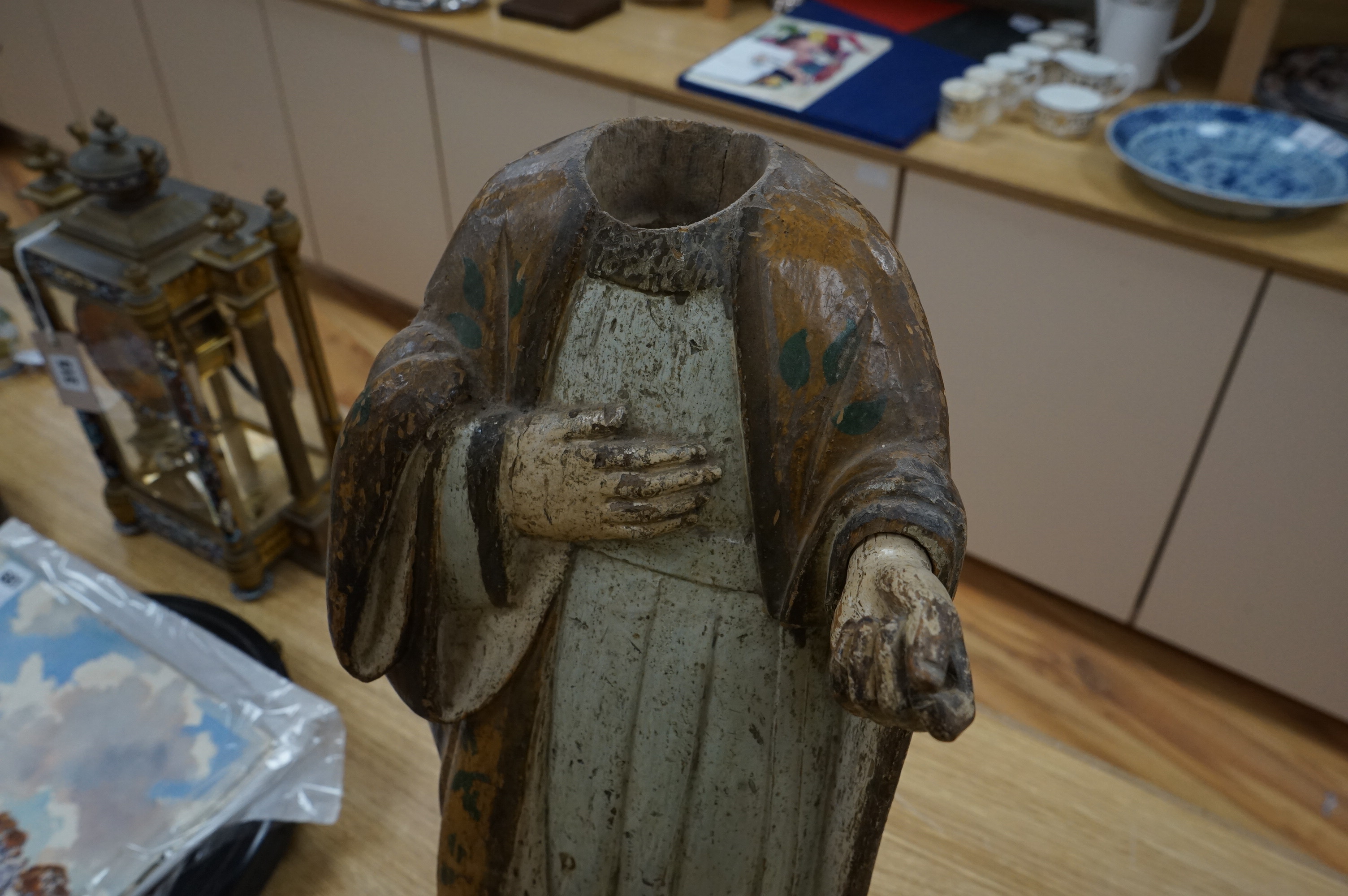 An 18th century Continental polychrome painted wooden religious figure, 64cm high. Condition - paint worn